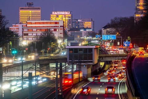 Motorway A40, Ruhr expressway, heavy traffic jam, rush hour, city passage in Essen, skyline of the