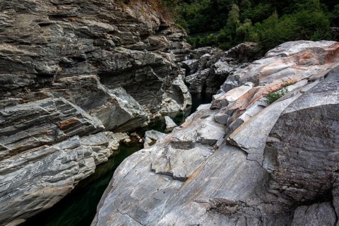 Rocks, granite rock formations in the Maggia River near Ponte Brolla, in the Maggia Valley, Valle