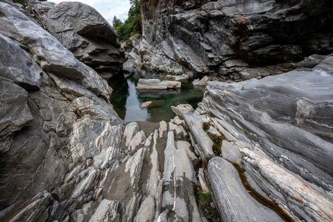 Rocks, granite rock formations in the Maggia River near Ponte Brolla, in the Maggia Valley, Valle