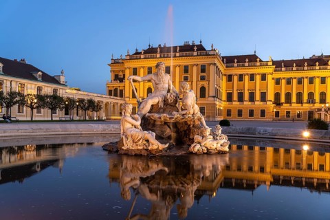 Fountain in the courtyard of honour at Schönbrunn Palace at dusk, UNESCO World Heritage Site in