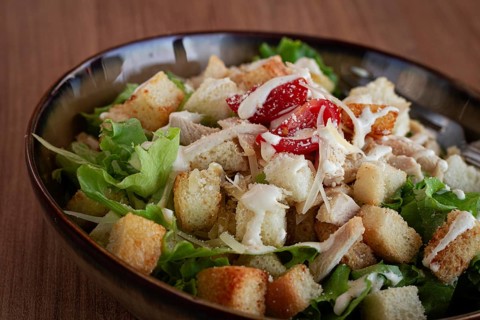 Classic Caesar salad, close-up, natural light, selective focus, horizontal