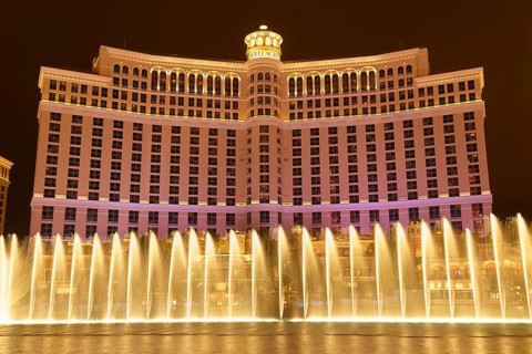 Illuminated Bellagio Hotel with water fountains in front of it at night, Las Vegas, Nevada, USA,