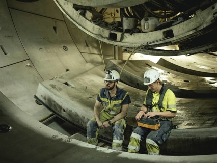 Workers in a tunnel section at the double-shield tunnel boring machine in section H53 of the