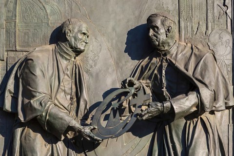Pope John Paul II hands over the World Youth Day Cross to his successor Pope Benedict XVI, bronze