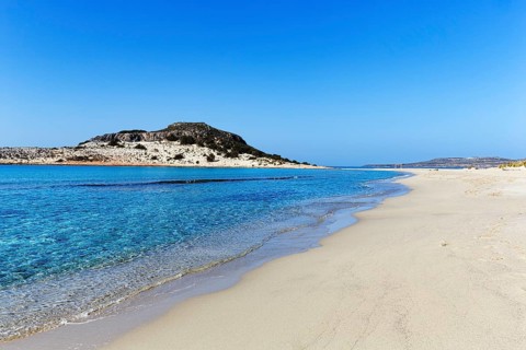 Crystal clear turquoise water, deserted dream beach in spring, Simos beach, Sarakiniko beach,