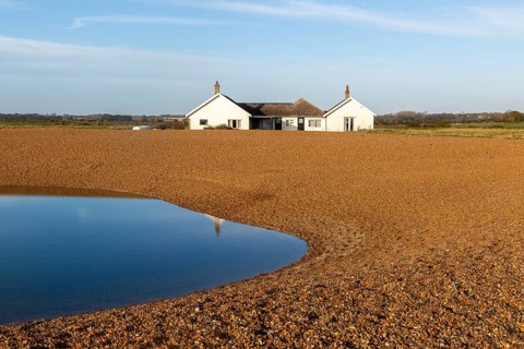 The Beacons bungalow house on beach at Shingle Street, Hollesley Bay, Suffolk, England, UK