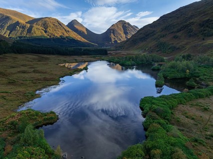 Mountains reflected in lake, morning light, sunny, autumn, aerial view, Lochan Urr, Glen Etive,