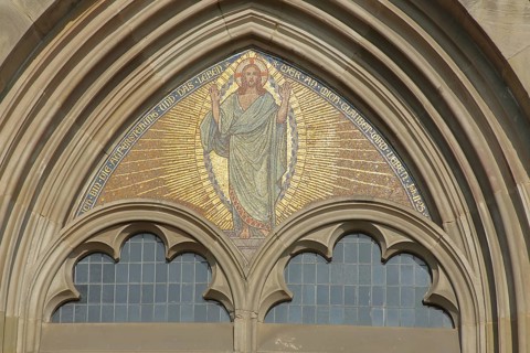 Tympanum with Christ and biblical quotation - I am the resurrection and the life whoever believes