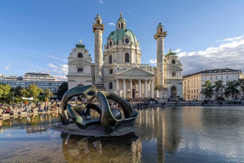 Sculpture by Henry Moore Hill Arches and the Karlskirche in Vienna, Austria, Europe