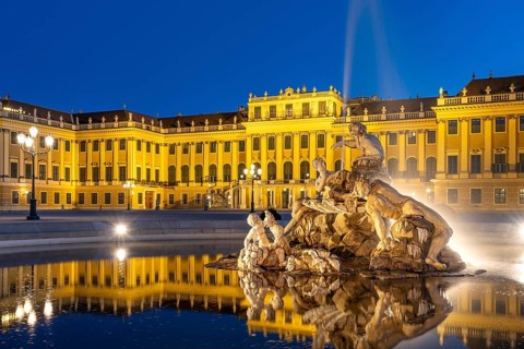 Fountain in the courtyard of honour at Schönbrunn Palace at dusk, UNESCO World Heritage Site in