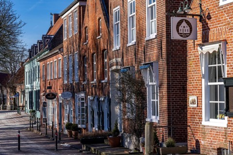 The fishing village of Greetsiel, municipality of Krummhörn, historic houses at the fishing