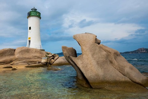 Lighthouse with beach and bizarre granite rocks, Spiaggia Porto Faro, Faro di Punta Palau, Palau,