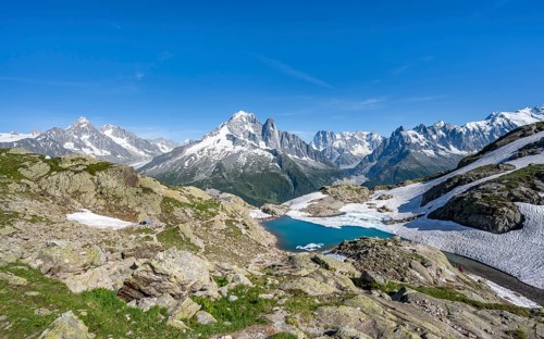 Mountain landscape with mountain lake Lac Blanc, mountain peaks, Aiguille Verte, Grandes Jorasses,