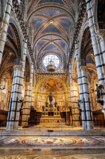 Interior with striped columns and decorated ceiling, Siena Cathedral or Cattedrale di Santa Maria