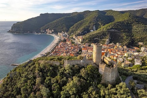 The castle Castello di Monte Ursino, Noli and the coast seen from the air, Noli, Riviera di