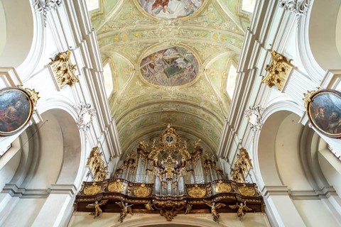 Church organ and ceiling frescoes in the baroque parish church Mariahilfer Kirche in Vienna,