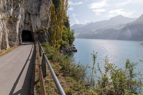 Path with a view and entrance to the historic tunnel along the steep rock faces on the northern