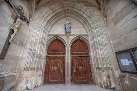 Male portal in Baroque style, late Gothic hall church of St George, Dinkelsbühl, Bavaria, Germany,