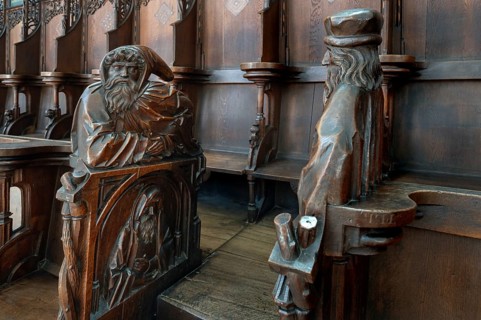 Figures on the late Gothic choir stalls from 1507, St Martin, Memmingen, Bavaria, Germany, Europe