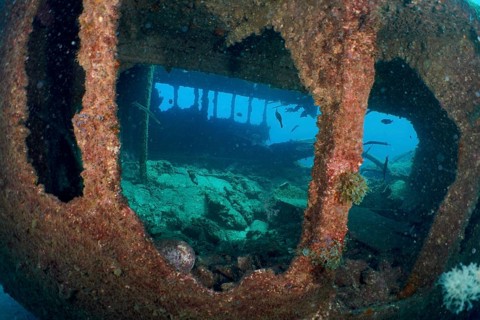 Underwater view of an old shipwreck in deep ocean blue, dive site Wreck of the Condesito, Las