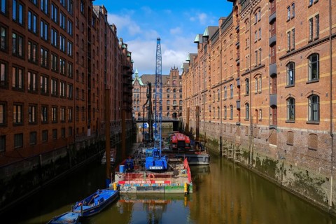 Hamburg, Germany - Speicherstadt, construction work in the canal, renovation of the water channel