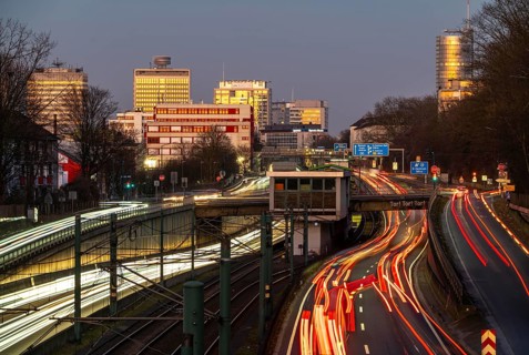 Motorway A40, Ruhr expressway, heavy traffic jam, rush hour, city passage in Essen, skyline of the