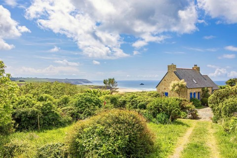 Old summer house on the french coast with a beautiful scenics seascape view and a lush green garden