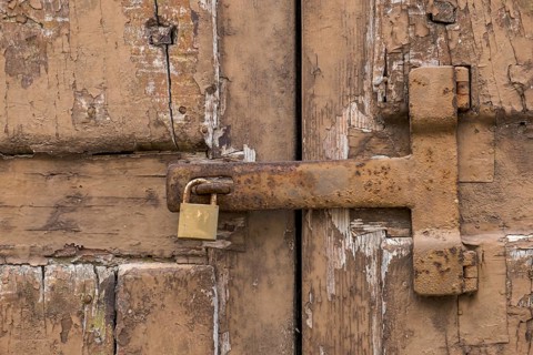 Dilapidated wooden gate with rusty metal fittings, Galatina, Apulia, Italy, Europe