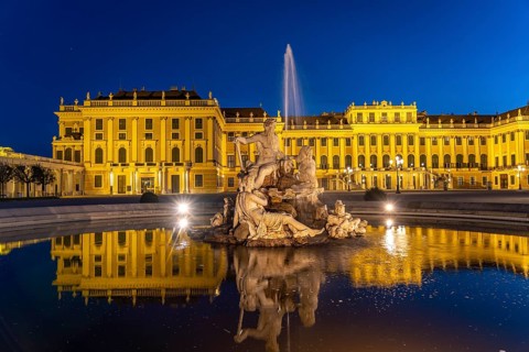 Fountain in the courtyard of honour at Schönbrunn Palace at dusk, UNESCO World Heritage Site in