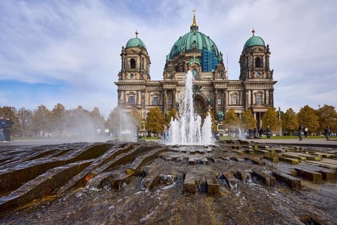 Fountain in the Lustgarten from the frog's perspective and Berlin Cathedral, Berlin, capital city,