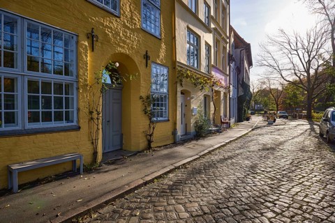 Street An der Obertrave, cobblestones, historic buildings with windows, doors and wall anchors,