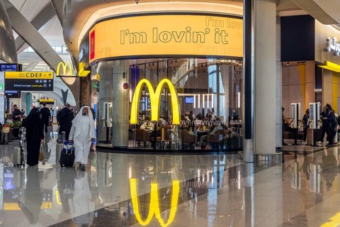 Abu Dhabi Airport, Zayed International Airport with passengers. McDonalds restaurant. The new