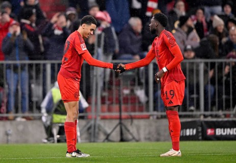 Goal celebration Jamal Musiala FC Bayern Munich FCB (42) (left) shakes hands with Dayot Upamecano
