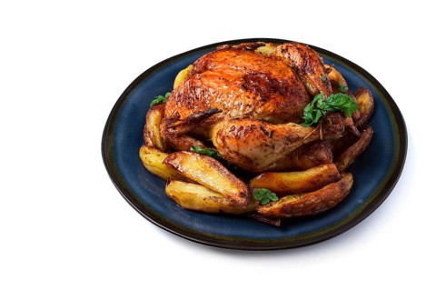 Fried whole chicken, with potatoes, on a white background, no people