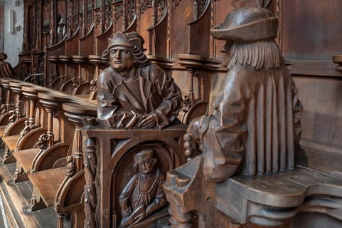 Figures on the late Gothic choir stalls from 1507, St Martin, Memmingen, Bavaria, Germany, Europe