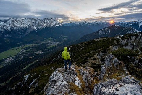 View Mountain panorama with Wetterstein mountains and Zugspitze, at sunset with sun star,