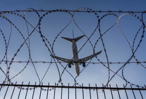 Symbolic image security at the airport, outer fence at Düsseldorf International Airport, steel wire