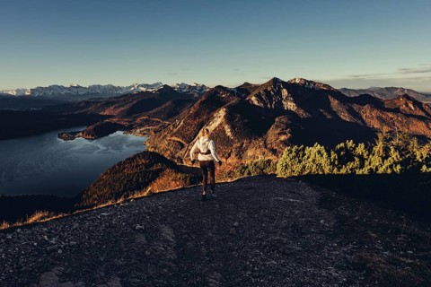 Trail running in autumn on the Jochberg on Lake Walchensee against the wonderful backdrop of the