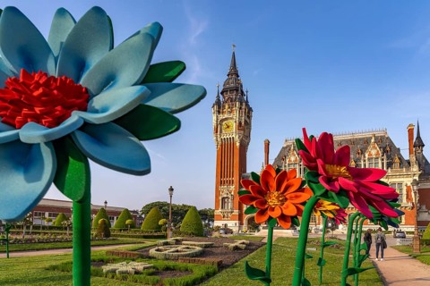 Giant artificial flowers in front of the town hall in Calais, France, Europe
