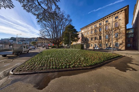 Piazza Manzoni, historical buildings, flower bed, trees, blue sky, veil clouds, street Riva