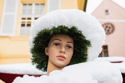 Mannequin covered with snow, Münsterplatz, Freiburg im Breisgau, Black Forest, Baden-Württemberg,