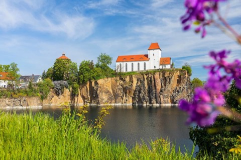 Mountain church and water tower on the Kirchberg, surrounded by the Kirchbruch quarry lake,
