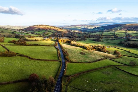 Farms over Trecastle from a drone at sunset, Brecon Beacons National Park, Powys, Wales, England,