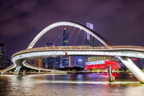 Guangzhou skyline with Haixin Bridge across the Pearl River skyscrapers at night in Guangzhou,