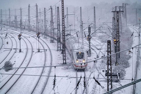 Winter weather, heavy snowfall, railway tracks in front of Essen main station, ICE train, North