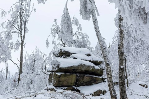 Rock formation with hoarfrost and snow on the summit of the Czorneboh, Lusatian Mountains, Upper