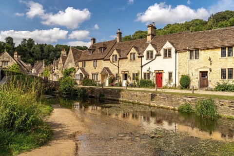 The village of Castle Combe on the River Bybrook, Cotswolds, Wiltshire, England, Great Britain
