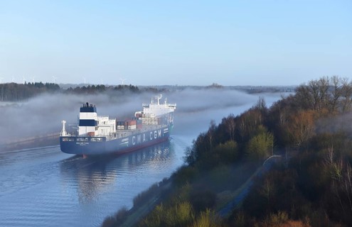 Container ship CMA CGM TIVOLI sailing in fog in the Kiel Canal, NOK, Kielkanal, Kiel Canal,