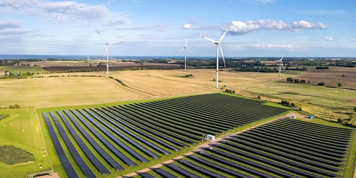 Wind farm and solar cells renewable energy wind power wind energy on the Baltic Sea aerial view