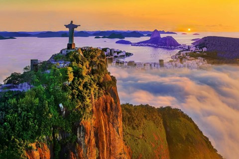 Corcovado 710m with Christ the Redeemer statue above Botafogo Bay with Sugar Loaf 396m at sunrise